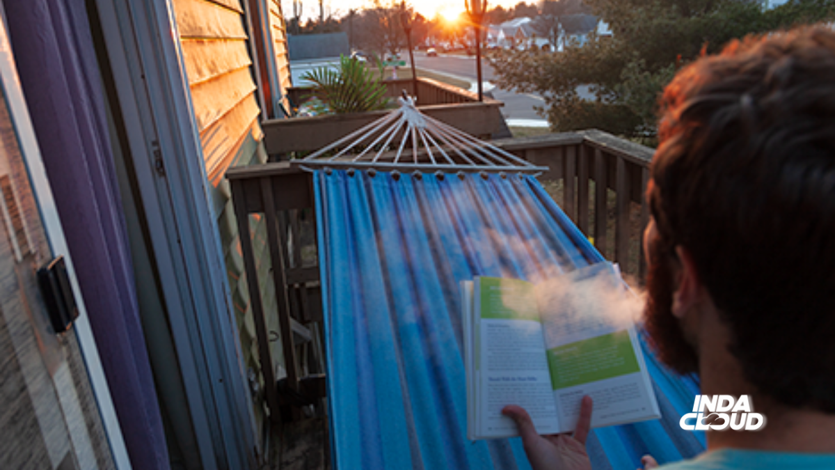 High Literature: The Best Books For An Elevated Mind 11 Person Relaxing On A Hammock, Reading A Book While Exhaling Vapor, With A Sunset In The Background.